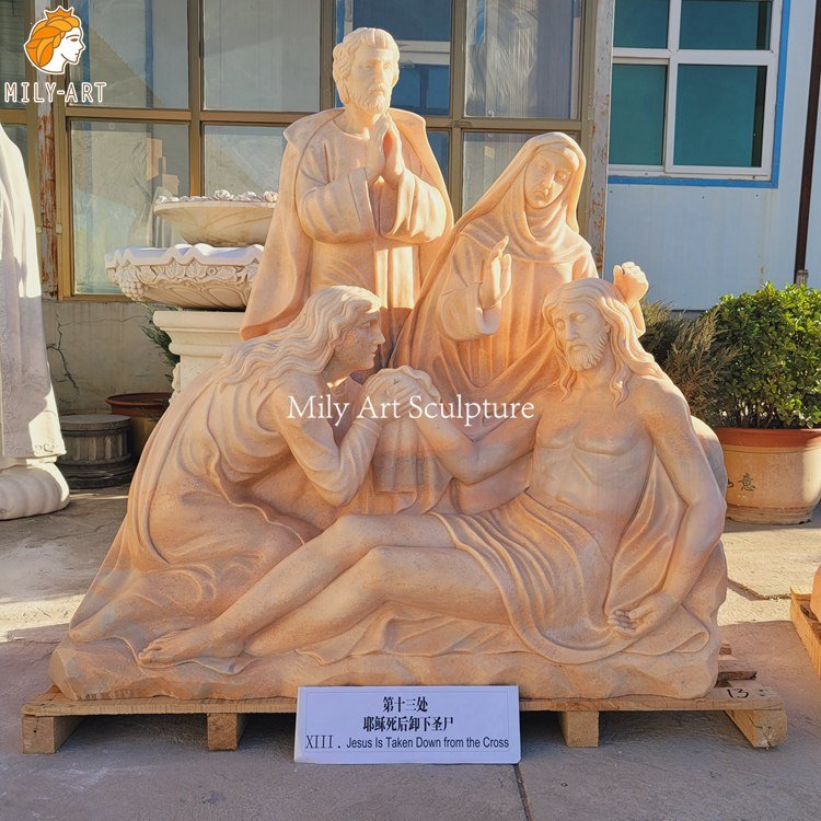 13.thirteenth station the body of jesus is taken down from the cross mily statue